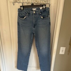 Good American Blue Ankle Cropped Jeans.  Some slight distress. Raw Hem.